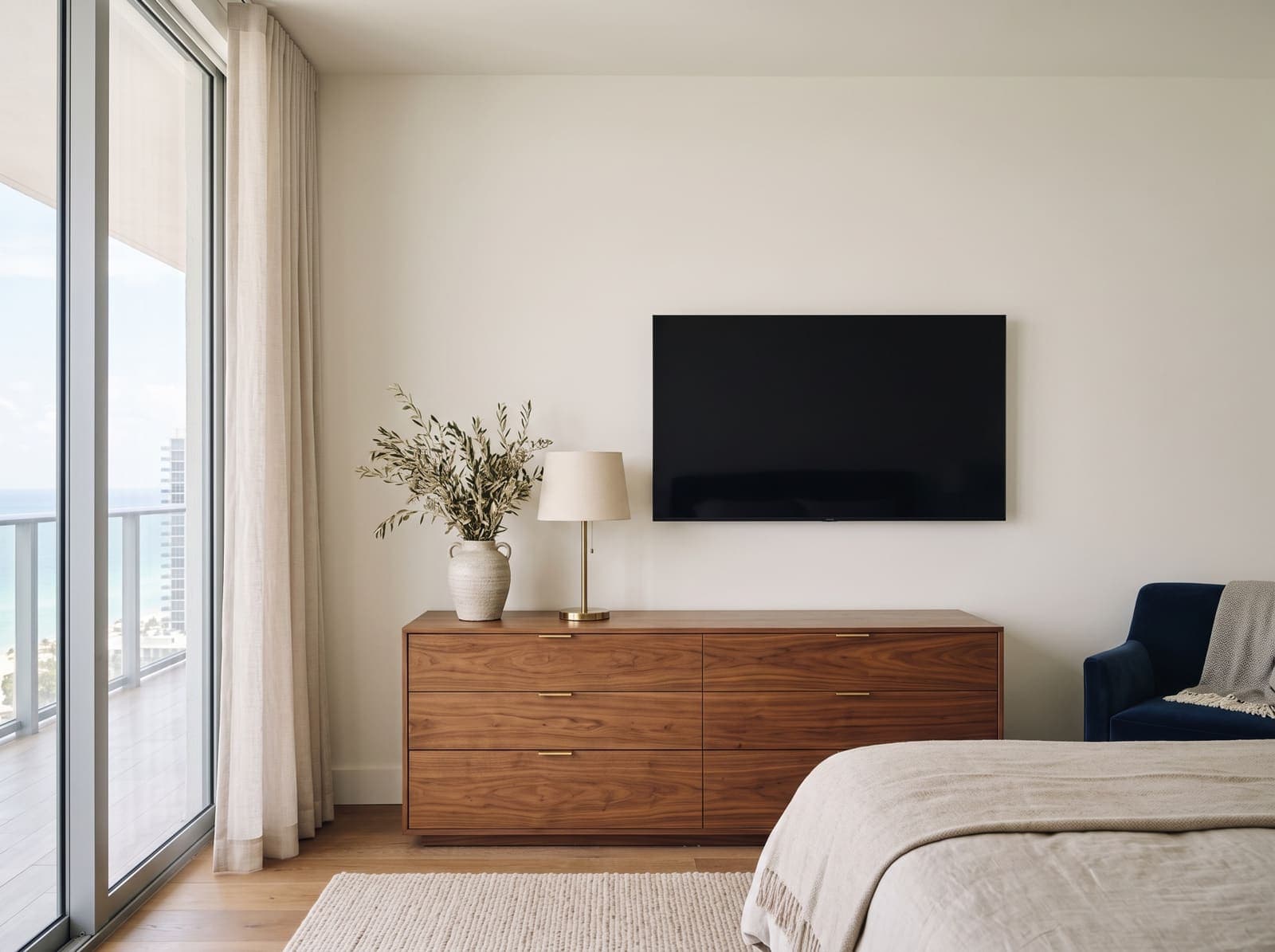 A TV mounted on a drywall wall